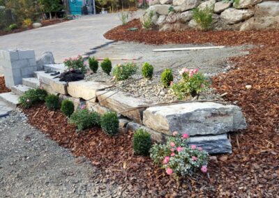 large rock garden with flowers and shrubs