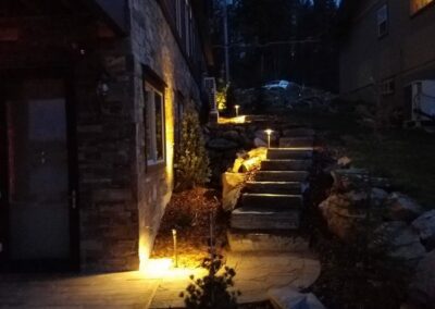 stone pathway and staircase with night time lighting