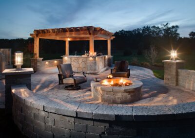 patio with wooden awning and circular firepit