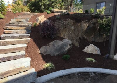 large stone staircase leading to circular landscaping
