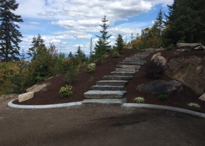 large stone staircase leading to circular landscaping