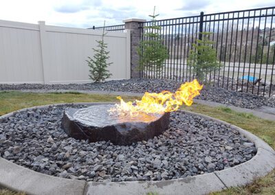 circular stone firepit with active flame