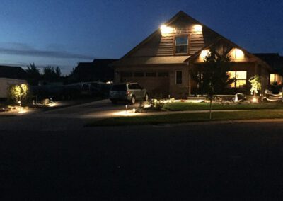 lights shining on exterior of house at night
