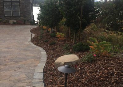 stone driveway pavement with new landscaping