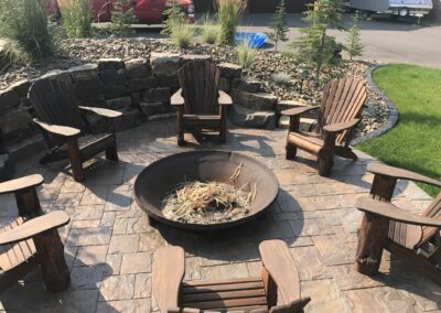 circular firepit surrounded by chairs