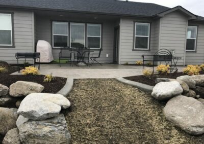 Yard with new pavement and landscaping