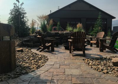 patio chairs around a circular fire pit
