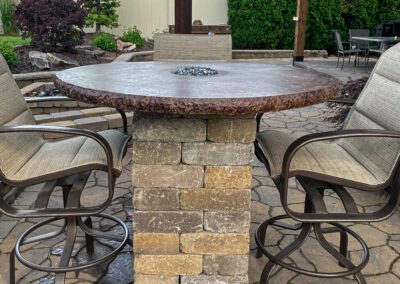 patio with a circular fire pit